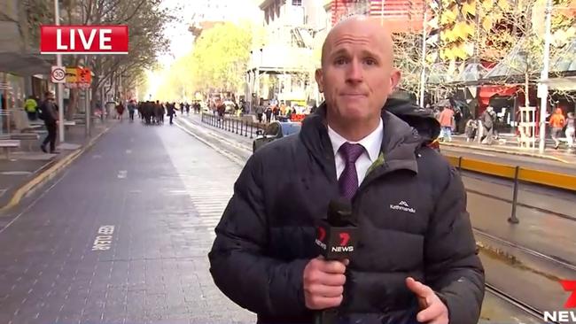 Channel 7 reporter Paul Dowsley on air after being attacked. Picture: 7 News