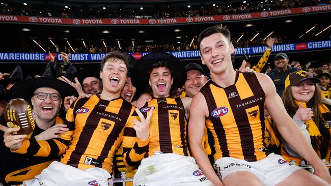 Ginnivan, Nick Watson and Connor Macdonald soaking up last Friday’s win. (Photo by Dylan Burns/AFL Photos via Getty Images)