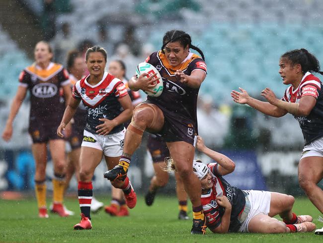 Amber Hall of the Broncos busts through the Roosters’ defence. Picture: Cameron Spencer/Getty Images