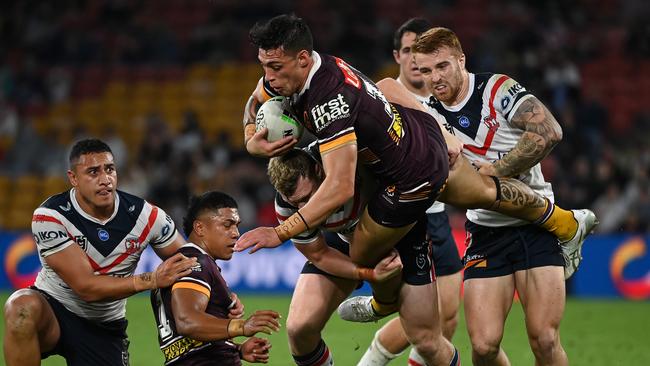 Jordan Riki is upended by the Roosters’ defence. Picture: NRL Images