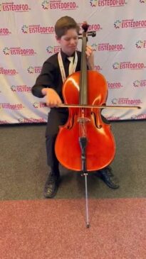 Gideon van Huyssteen performing on the cello.