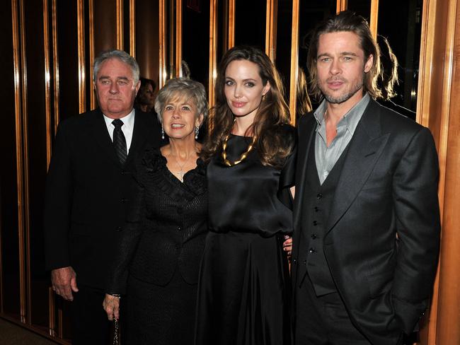 2011: Angelina Jolie and Brad Pitt pose with Bill Pitt and Jane Pitt at the after party for the premiere of “In the Land of Blood and Honey” at the The Standard Hotel Rooftop in 2011 in New York City. Picture: Getty