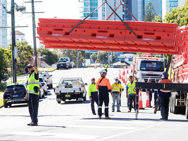 The new border wall is lowered into place in Coolangatta yesterday. Picture: Nigel Hallett