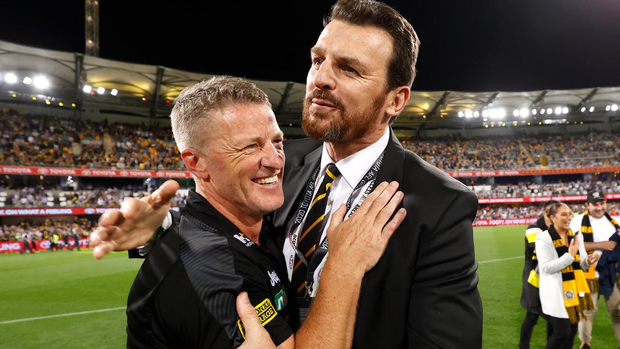 BRISBANE, AUSTRALIA - OCTOBER 24: Damien Hardwick, Senior Coach of the Tigers and CEO Brendon Gale celebrate during the 2020 Toyota AFL Grand Final match between the Richmond Tigers and the Geelong Cats at The Gabba on October 24, 2020 in Brisbane, Australia. (Photo by Michael Willson/AFL Photos via Getty Images)