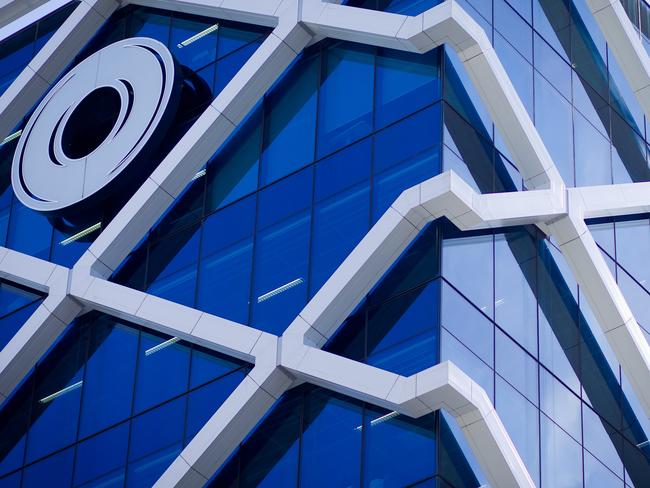 The Macquarie Group Ltd. logo is displayed on the facade of the Macquarie Group Building in Sydney, Australia, on Friday, April 27, 2012. Macquarie Group Ltd., Australia's largest investment bank, said it's relying on cost cuts to revive earnings after a slump in trading income and dealmaking dragged full-year net income to an eight-year low. Photographer: Ian Waldie/Bloomberg