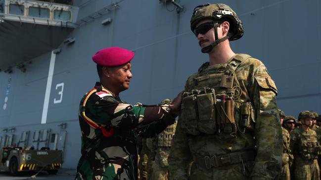 Indonesian National Armed Forces Head of Delegation Lieutenant Colonel Empri Airudin during a ceremonial patch sharing ceremony aboard the HMAS Adelaide in Darwin ahead of Exercise Keris Woomera on November 3. Picture: Zizi Averill