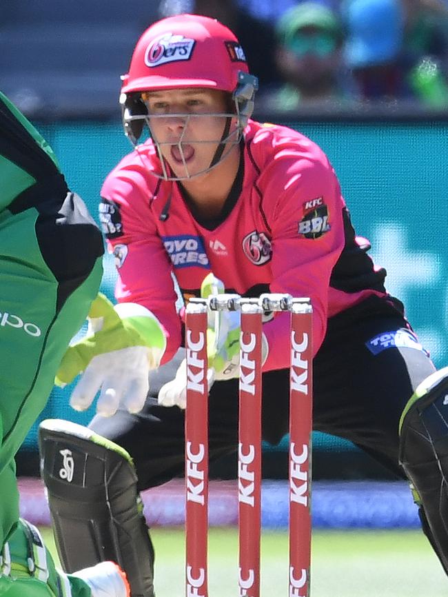 Josh Phillipe wicketkeeping for Sydney Sixers.