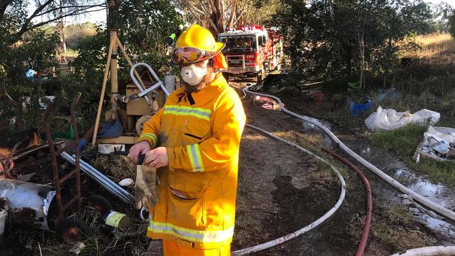 Firefighters mop up after extinguishing the blaze. Picture: Doreen CFA.