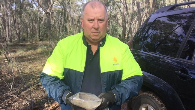 Daryl Floyd, the brother of missing murdered schoolboy Terry Floyd, 12, with a shoe he has found down the old gold mine he believes Terry's body was dumped down in 1975.