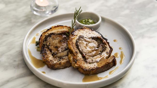 Porky heaven: Porchetta Di Ariccia- Slowly roasted pork belly roll, seasoned with fresh garlic &amp; rosemary. Picture: Mark Cranitch.