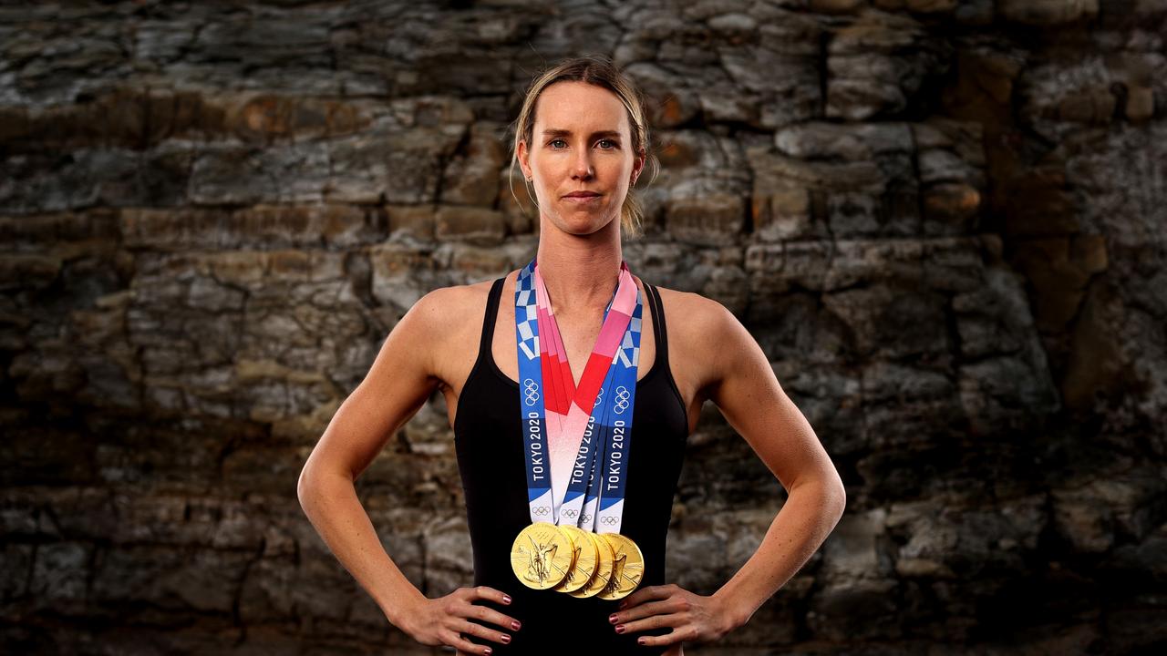 Australian swimmer Emma McKeon poses with her four gold medals from Tokyo. Photo by Brendon Thorne/Getty Images.