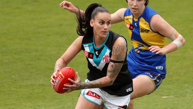 Gemma Houghton of the Power looks to pass the ball during the 2022 S7 AFLW Round 01 match between the West Coast Eagles and the Port Adelaide Power at Mineral Resources Park on August 27, 2022 in Perth, Australia. Picture: Will Russell/AFL Photos via Getty Images