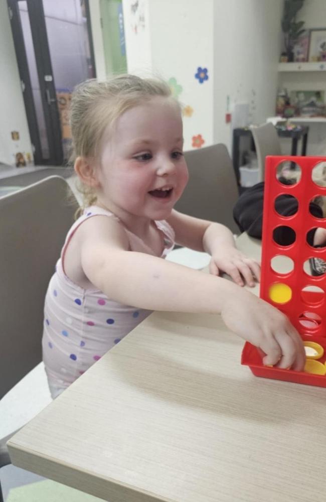 Luna playing Connect 4 while she recovers at the Geelong hospital. Picture: Supplied