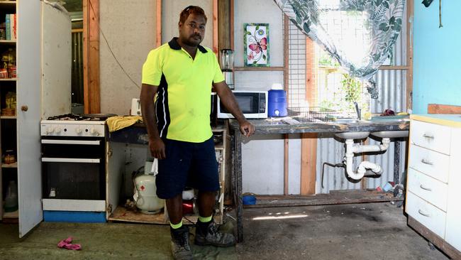 Colin Fourmile stands in his kitchen, inside his Yarrabah home. Picture: Isaac McCarthy