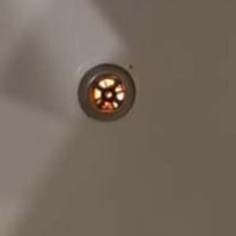 The woman discovered a bright light shining through the plughole in her hotel bathtub. Picture: Facebook