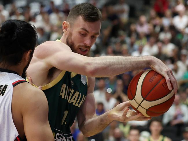 GIPPSLAND, AUSTRALIA - FEBRUARY 20: Nick Kay of Australia and Muhammad Guntara of Indonesia contest the ball during the FIBA Asia Cup Qualifier match between Australia Boomers and Indonesia at Gippsland Regional Indoor Sports Stadium on February 20, 2025 in Gippsland, Australia. (Photo by Daniel Pockett/Getty Images)