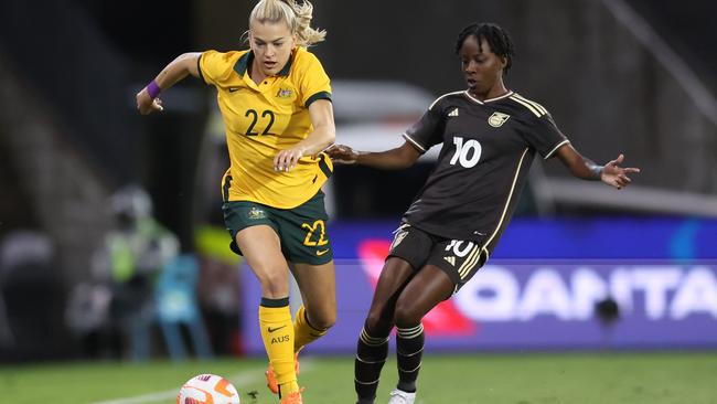 Jody Brown of Jamaica competes for the ball with Charli Grant during the Cup of Nations match between the Australia Matildas and Jamaica at McDonald Jones Stadium on February 22, 2023 in Newcastle. Picture: Scott Gardiner/Getty