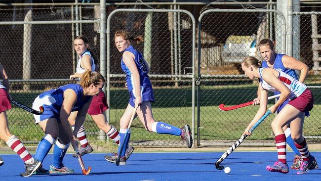 Ellynie Cameron (right) has been in scintillating goal-scoring form for McAuley White in Grafton Women's First Grade Hockey this season.