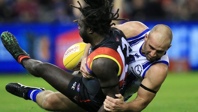 Anthony McDonald-Tipungwuti is taken to ground by Ben Cunnington. Picture: Mark Stewart