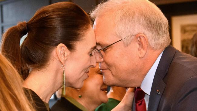 Scott Morrison receives a traditional "hongi" greeting from New Zealand's Prime Minister Jacinda Ardern. Picture: Getty