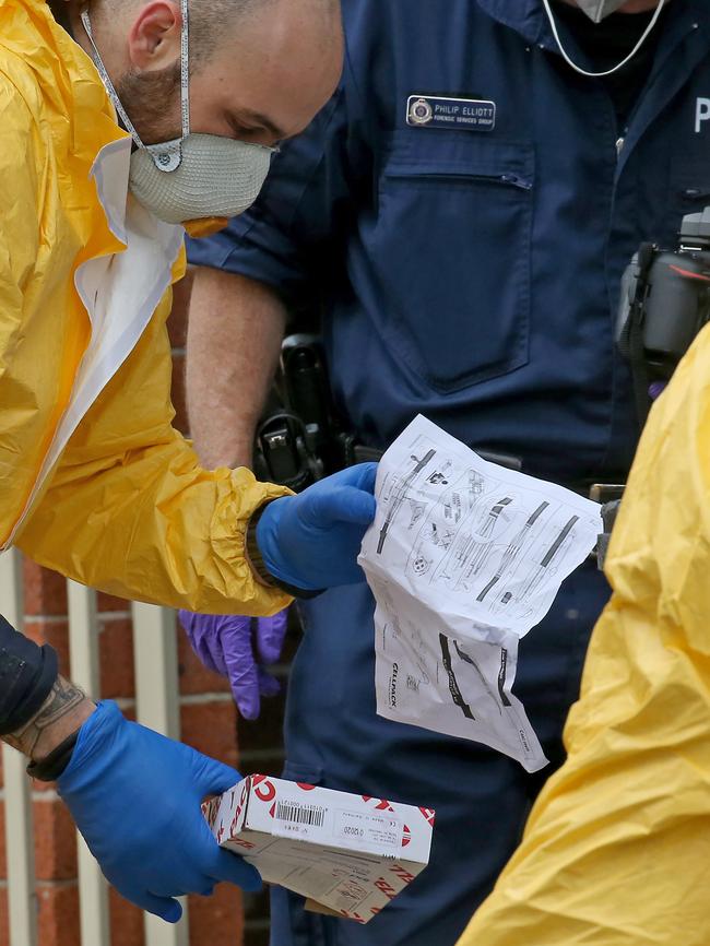 Police search premises in Lakemba after the alleged terror plot led to arrests. Picture: Toby Zerna