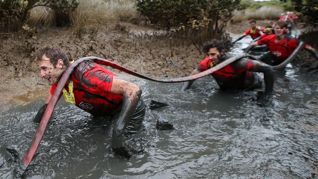 Jobe Watson walks through the mud. Picture: Michael Klein