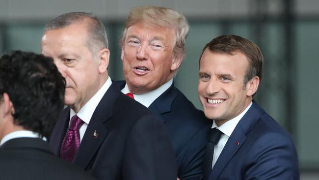 Donald Trump jokes with France's President Emmanuel Macron at a 2018 NATO summit in Brussels. Picture: AFP