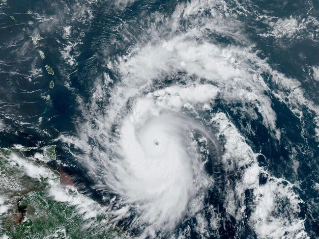 This National Oceanic and Atmospheric Administration (NOAA)/GOES satellite handout image shows Hurricane Beryl at 17:50UTC on June 30, 2024. Beryl, the first hurricane of the 2024 Atlantic season, strengthened into an "extremely dangerous" Category 4 storm Sunday as it threatened the southeast Caribbean with potentially life-threatening winds and storm surge, US trackers said (Photo by HANDOUT / NOAA/GOES / AFP) / RESTRICTED TO EDITORIAL USE - MANDATORY CREDIT "AFP PHOTO /NOAA/GOES" - NO MARKETING NO ADVERTISING CAMPAIGNS - DISTRIBUTED AS A SERVICE TO CLIENTS