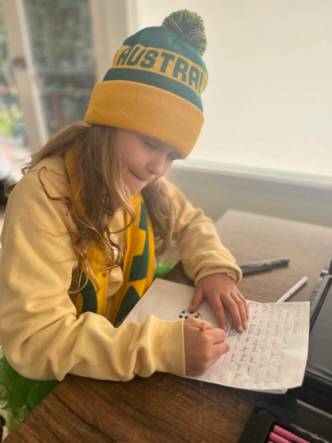 Ella, of Elanora Heights, penning her letter.