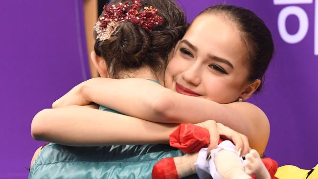 Russia's figure skating gold medallist Alina Zagitova (right) hugs her friend, training partner and rival, silver medallist Evgenia Medvedeva. Photo: AFP