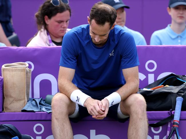 LONDON, ENGLAND - JUNE 19: Andy Murray of Great Britain looks dejected as he is forced to pull out of the match due to injury against Jordan Thompson of Australia in the Men's Singles of 16 match on Day Three of the cinch Championships at The Queen's Club on June 19, 2024 in London, England.  (Photo by Clive Brunskill/Getty Images)