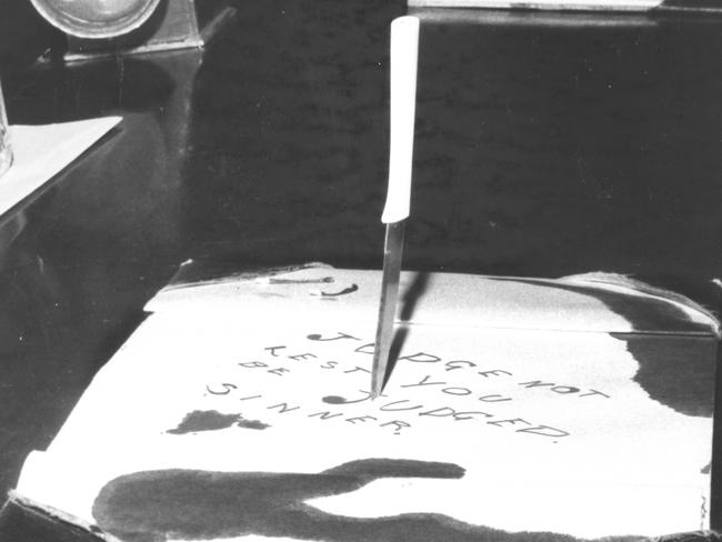 1968: “Judge not lest you be judged, sinner,’’ the note read, and if that wasn’t dramatic enough, the arsonist drove a knife into it on a desk inside Brisbane’s old Supreme Court. David Brooks, who held a grudge against police and the justice system, decided to“get square’’ and left the note before setting a destructive fire. Picture: Graham Hutton/File