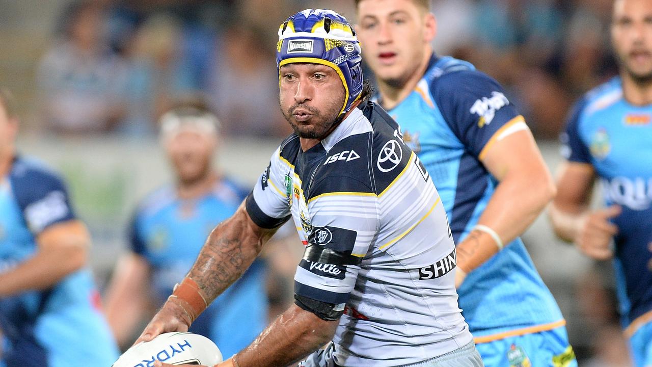 GOLD COAST, AUSTRALIA - MARCH 25: Johnathan Thurston of the Cowboys takes on the defence during the round four NRL match between the Gold Coast Titans and the North Queensland Cowboys at Cbus Super Stadium on March 25, 2017 in Gold Coast, Australia. (Photo by Bradley Kanaris/Getty Images)