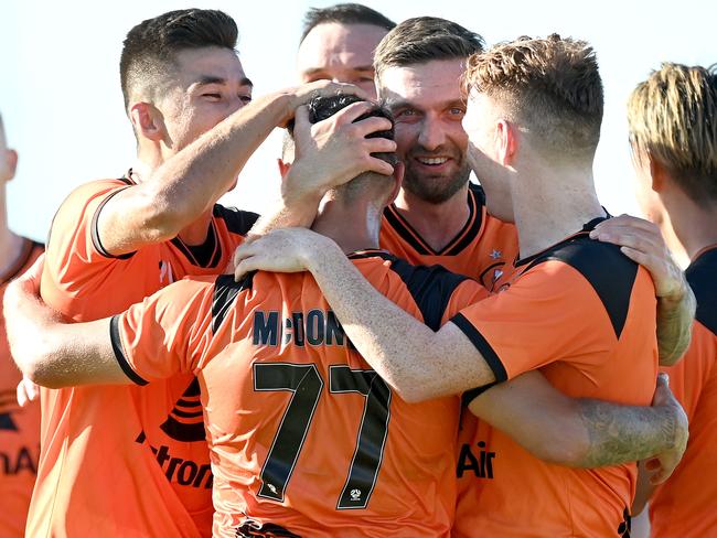 BRISBANE, AUSTRALIA - FEBRUARY 06: Scott McDonald of the Roar is congratulated by team mates after scoring a goal during the A-League match between the Brisbane Roar and the Melbourne Victory at Dolphin Stadium, on February 06, 2021, in Brisbane, Australia. (Photo by Bradley Kanaris/Getty Images)