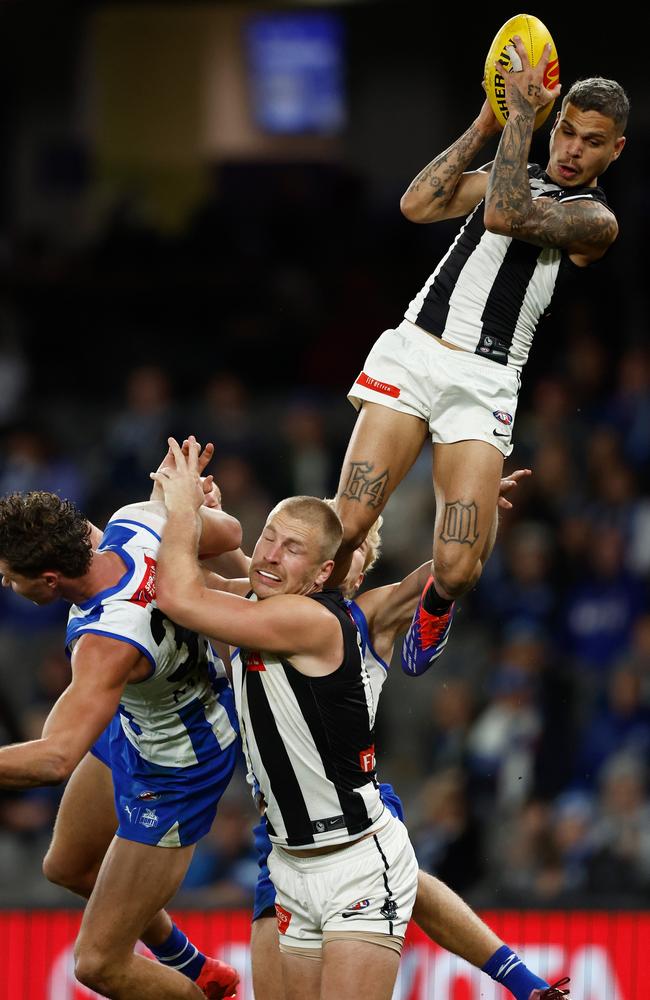 Bobby Hill of the Magpies takes a screamer against North Melbourne. Picture: Michael Willson/AFL Photos via Getty Images.
