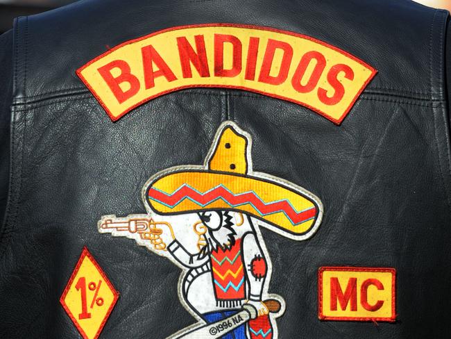 A Members of the Bandidos MC joins members from 14 NSW outlaw motorcycle gangs at Moore Park as part of the United Motorcycle Council for a Legalise Freedom ride, Sydney, Saturday, June 13, 2009. The clubs represented were Hells Angels, Bandidos, Rebels, Comanchero, Nomads, Finks, Black Uhlans, Vietnam Veterans, Phoenix, Grave Diggers, Outcasts, Life and Death, Gods Squad and Bikers for Christ. (AAP Image/Dean Lewins) NO ARCHIVING, INTL OUT