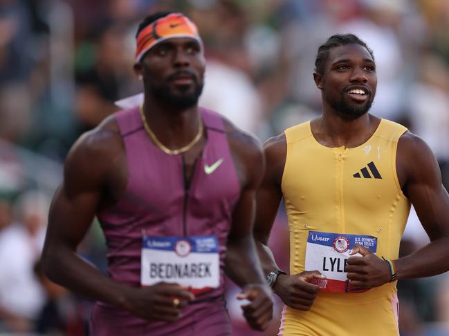 EUGENE, OREGON - JUNE 30:  Noah Lyles (R) and Kenny Bednarek react after finishing the men's 200 meter final on Day Nine of the 2024 U.S. Olympic Team Track & Field Trials on June 29, 2024 in Eugene, Oregon. (Photo by Christian Petersen/Getty Images)