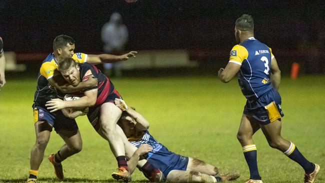 Valleys Drew Jackson tackled by Cory McGrady for Highfields. Valleys vs Highfields. TRL Hutchinson Builders A Grade. Saturday, June 11, 2022. Picture: Nev Madsen.