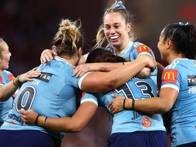 The Blues celebrate winning game one of the Women's State of Origin series. Picture: Chris Hyde/Getty Images