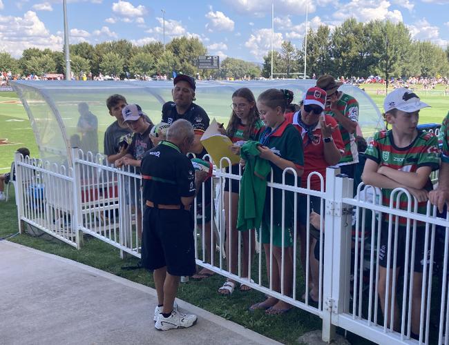 Reggie The Rabbit signing autographs.