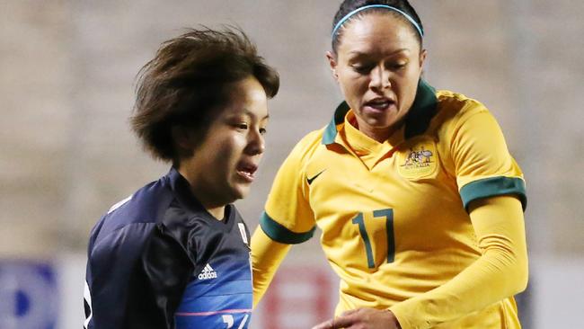 Australia's Kyah Simon and Japan's Mana Iwabuchi during the opening Olympic qualifier in Osaka, won by Australia. Picture: AFP