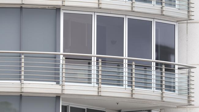 Pictured is the enclosed balcony of the apartment belonging to Alan Jones after he was charged with sexual assault and indecent touching spanning decades. Picture: Richard Dobson