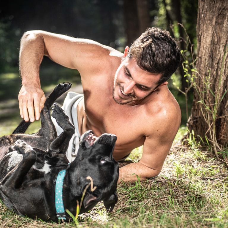 “I love dogs and I don’t own a shirt so I thought this would be the perfect project,” says Drew Harrisberg of the Hot Guys and Rescue Dogs calendar. “It was my first time going to a dog shelter and it was really overwhelming. I walked dozens of dogs to take them out of their cage. I felt a responsibility to give them a dose of freedom while I can.” Harrisberg adopted a dog from the shelter after the first year he was on the shoot, and now the 10-year-old black staffy named Dennis (pictured), is one of the stars of the 2020 calendar.