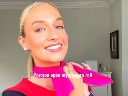 Qantas flight attendant getting ready for a flight