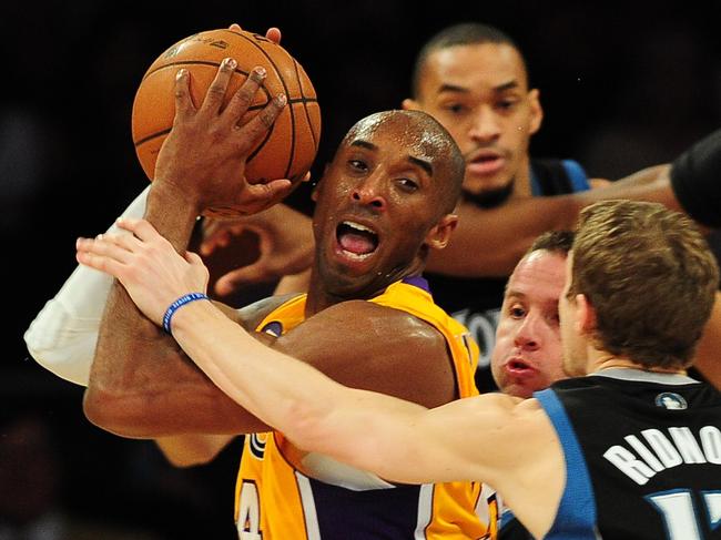 Kobe Bryant of the LA Lakers is ensnared in heavy traffic with J.J. Barea and Luke Ridnour of the Minnesota Timberwolves during their NBA game in Los Angeles, California on February 28, 2013. Picture: Getty