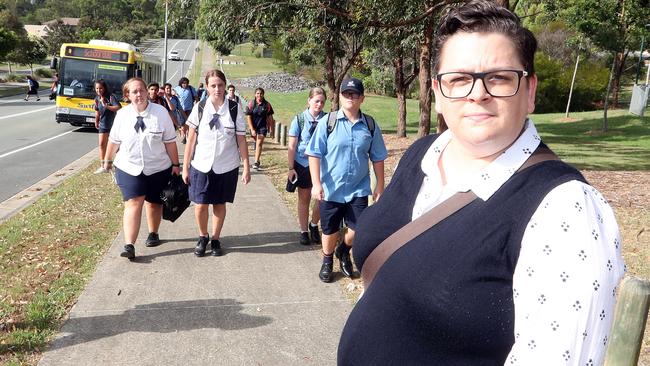 Skye O'Dwyer and daughter Amber Jones (16) (2nd from left in white) at Waverly Drive, Willowvale. School buses have been arriving late, overcrowded and leaving students behind on the side of the road on the way to Pimpama State Secondary School. Photo by Richard Gosling