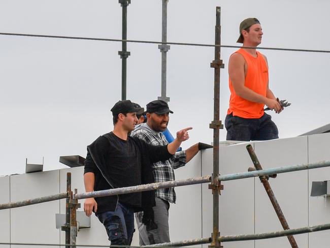 Construction workers builders tradies not adhering to the distancing laws of 1.5m on site  Picture: Jason Edwards