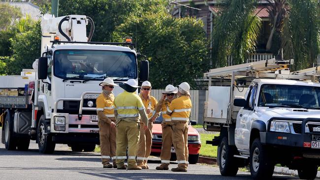Energex linesman are going from house to house around Depot Hill and other low-lying areas of Rockhampton disconnecting power where those houses have hot water systems or power boxes below the predicted flood levels. Picture: Tim Marsden