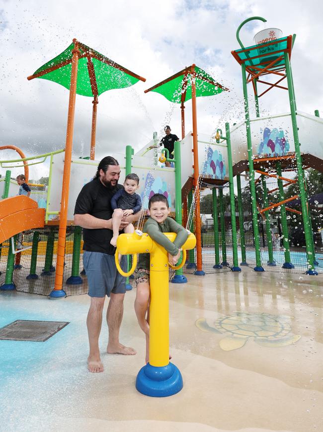 Ingenia Cairns Coconut holiday park has upgraded its very popular splash park, with the original splash park being replaced after 15 years. Jono Crago from Adelaide and his sons Carter Crago, 20 months, and Lennox Crago enjoy the new splash park at Cairns Coconut holiday park. Picture: Brendan Radke