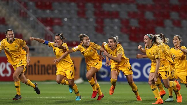 AMMAN, JORDAN - APRIL 17:  Players of Australia celebrate winning the AFC Women's Asian Cup semi final between Australia and Thailand after a penalty shoot out at the King Abdullah II Stadium on April 17, 2018 in Amman, Jordan.  (Photo by Francois Nel/Getty Images)